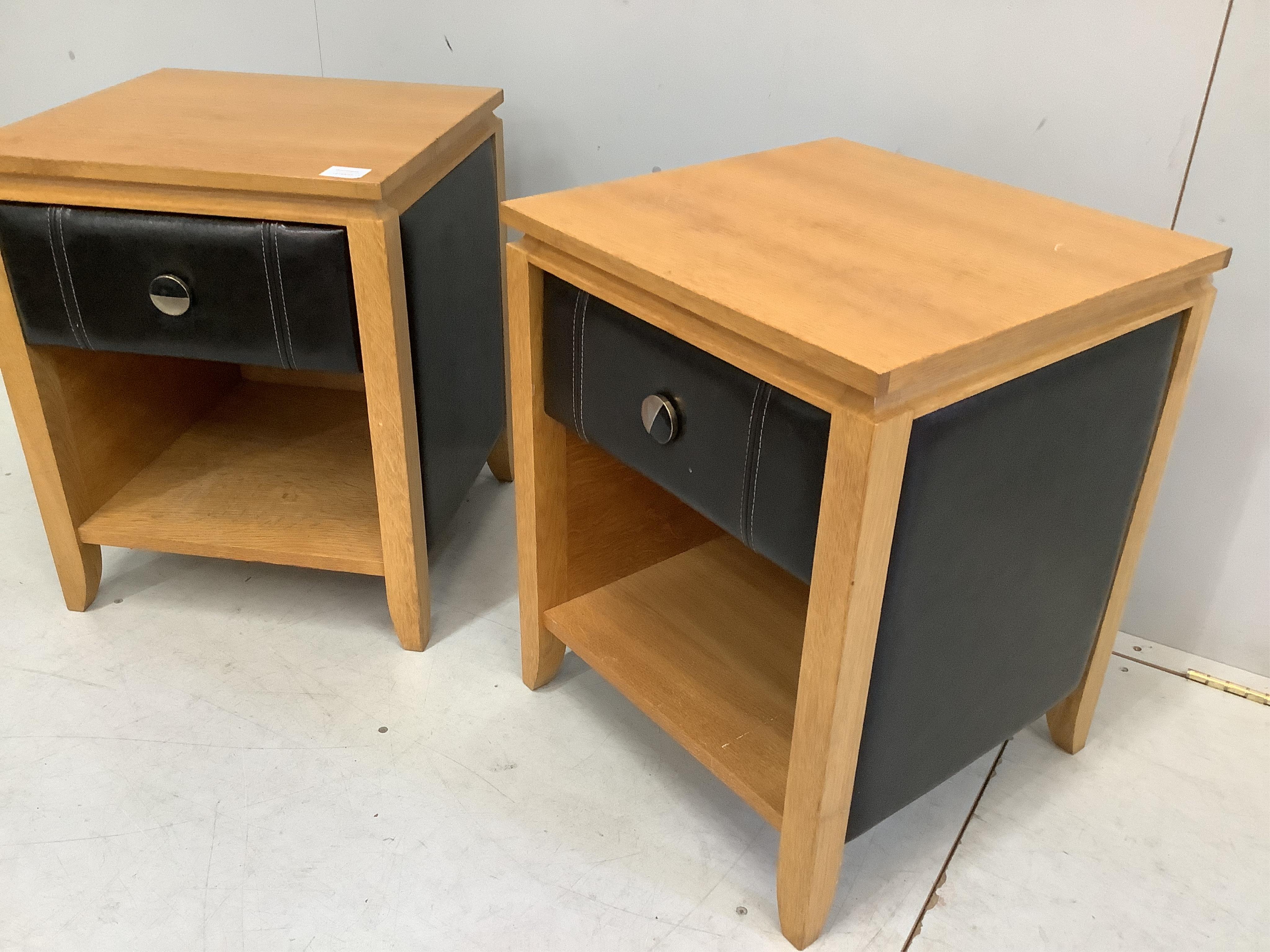 A pair of oak and tan leather bedside cabinets, width 45cm, depth 44cm, height 56cm